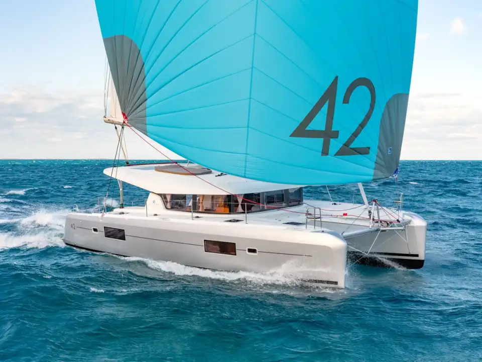 Lagoon 42 catamaran under a blue gennaker marked “42”